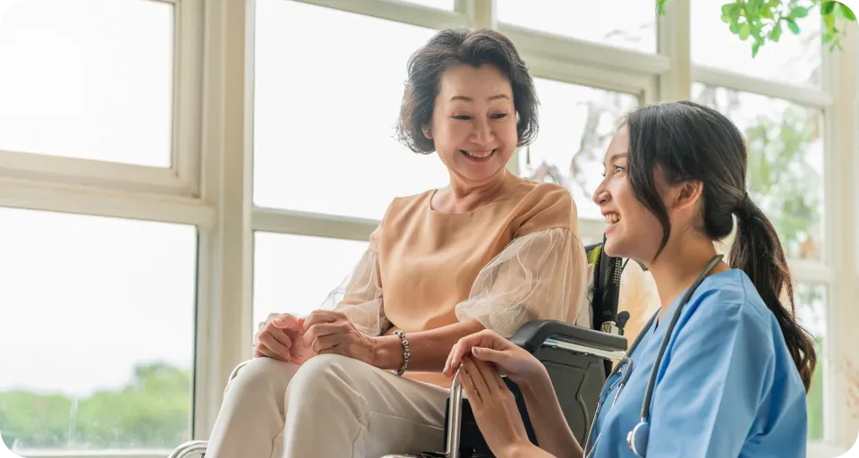 Caregiver supporting elderly person